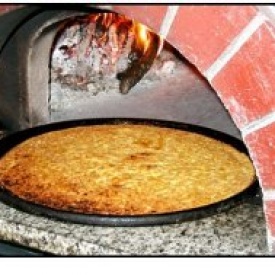 Ricettario Genovese: Farinata, una specie di surrogato del pane per i più poveri.
